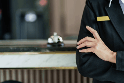 A gaming attendant waits by a desk