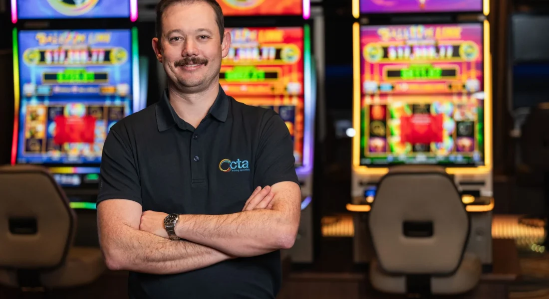 CTA Trainer stands in front of gambling machines