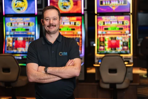 CTA Trainer stands in front of gambling machines