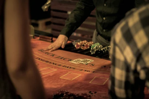 Dealer at a blackjack table